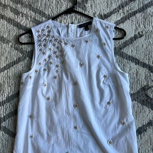 White Cotton top with embellishments.Beautiful details and rarely worn